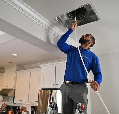 Attica Air Duct Cleaners technician performing professional air duct cleaning in an Orlando home